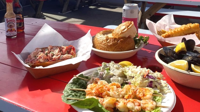 Various seafood dishes at an outdoor table at Malibu Seafood.