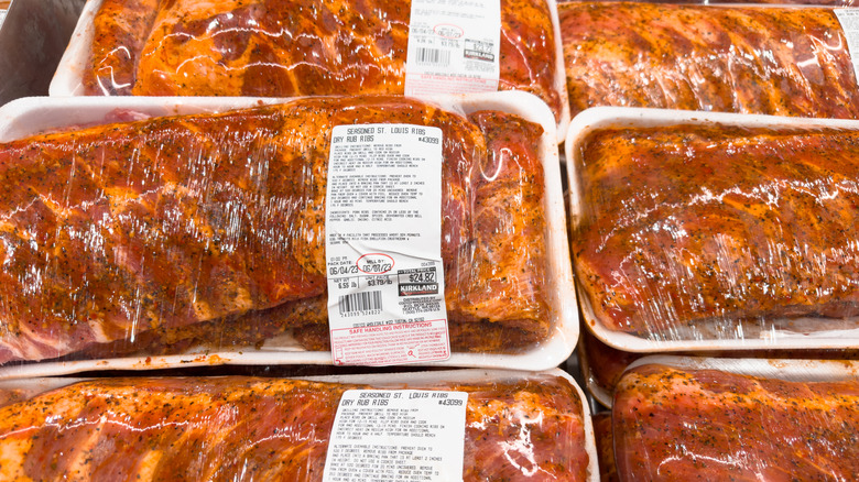 Several packages on display of Costco's Kirkland seasoned St. Louis ribs
