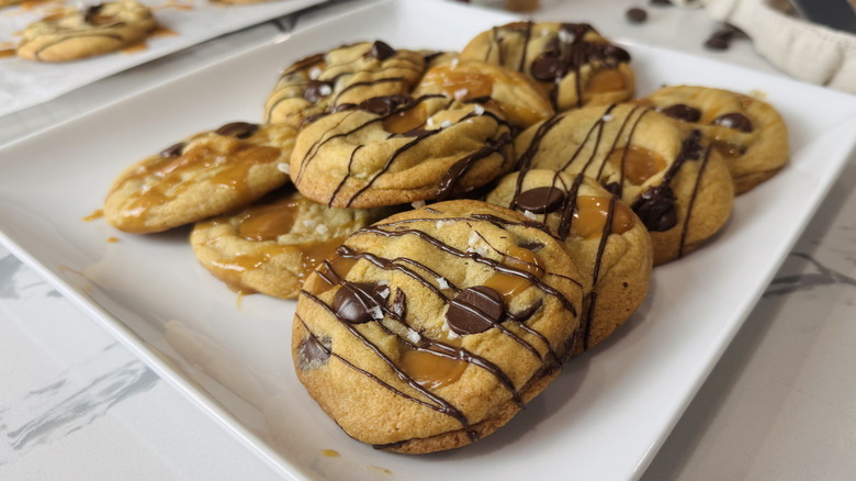 plate of chocolate chip and caramel cookies on marble surface