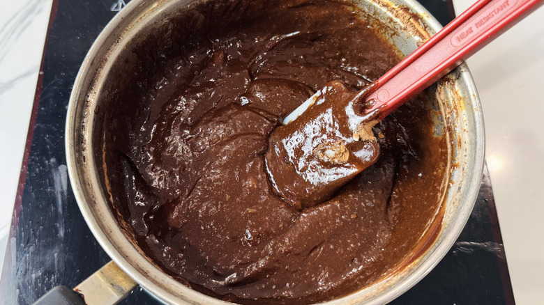 Brownie batter in bowl with rubber spatula