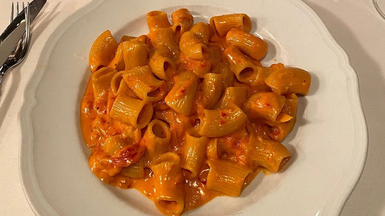 Spicy vodka rigatoni dish served in white bowl at Carbone in New York City.