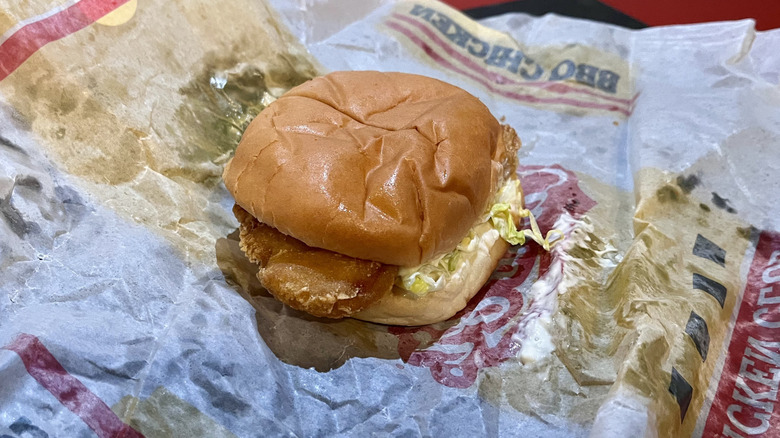 A fish sandwich from Carl's Jr. sitting on its wrapper