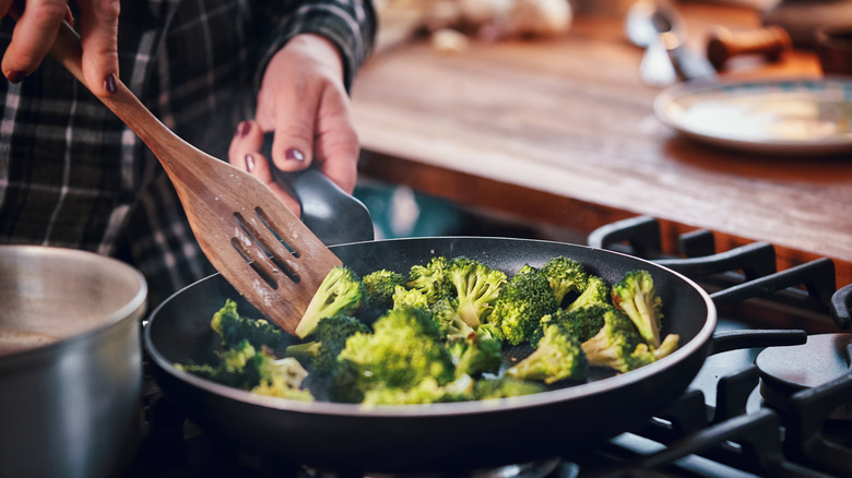 brown man with hot pan