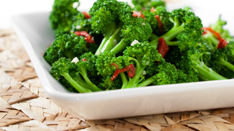 flavored broccoli on white plate