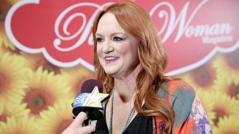 Ree Drummond speaking into a microphone at a media event