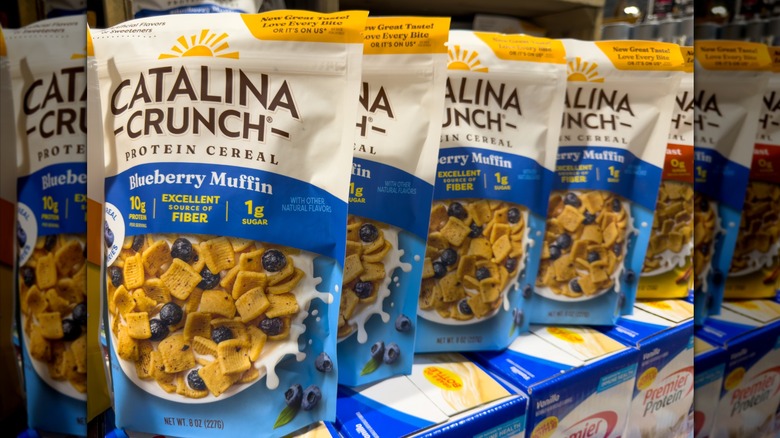 Packages of Blueberry Muffin Catalina Crunch cereal on a grocery store shelf