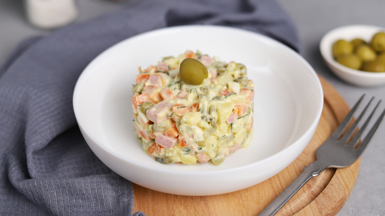 Ensaladilla Rusa topped with an olive.