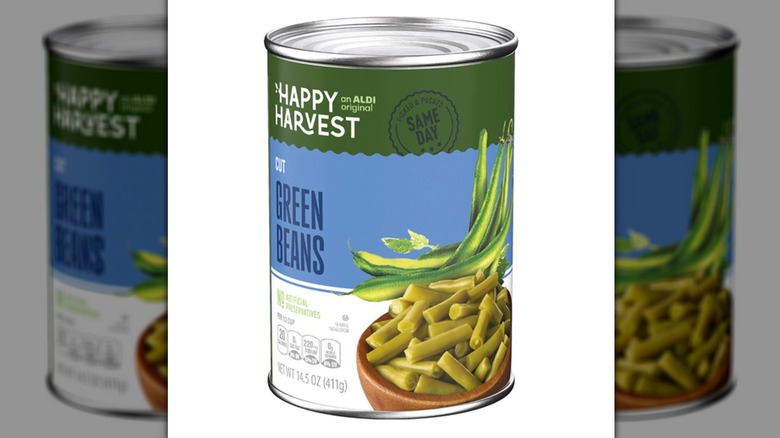 Can of Happy Harvest Cut Green Beans on white background.