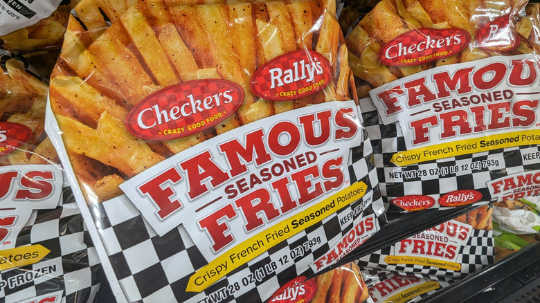 Bags of Checkers fries on a freezer shelf