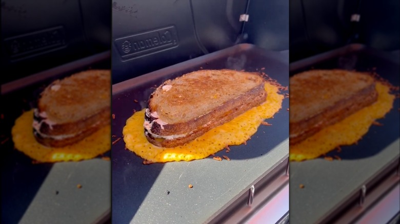 Cheese skirt on grill with grilled cheese