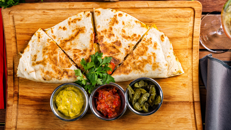 quesadilla served with trio of sauces