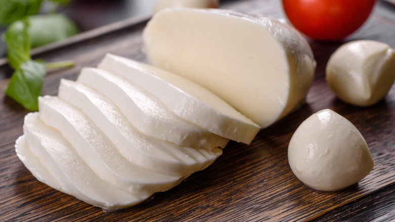 slices of fresh mozzarella cheese with tomato and basil
