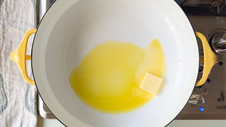 Butter and olive oil in large pot on stovetop