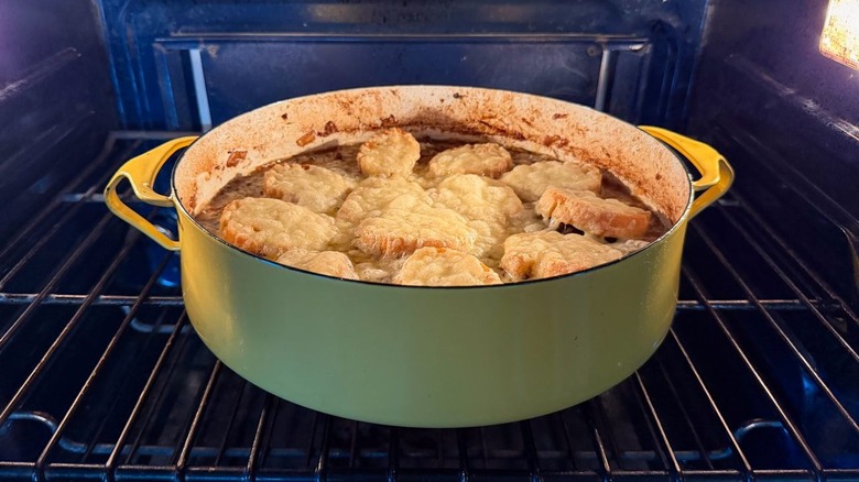 Cheesy French onion pot roast in oven under broiler