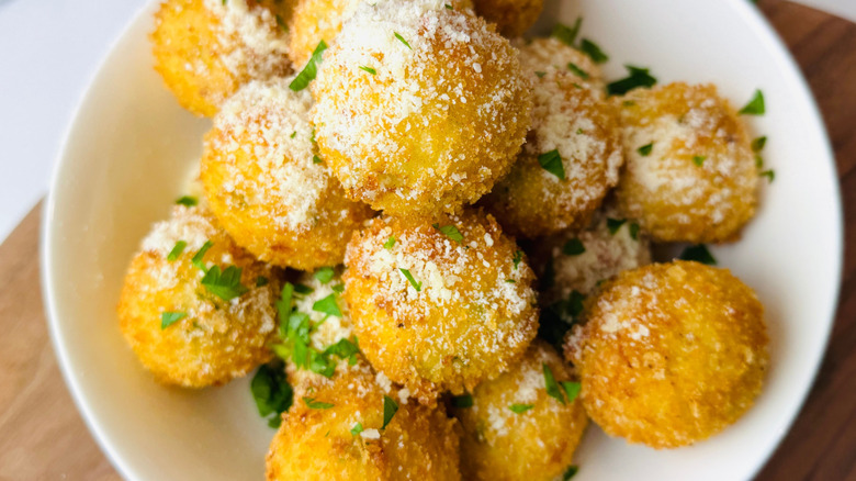 Mashed potato balls garnished with parmesan and parsley