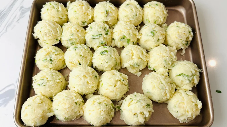 Mashed potato balls on baking sheet