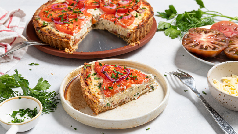 Roasted tomato pie with a slice cut out on a plate