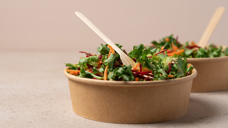 Healthy salads in takeout bowls