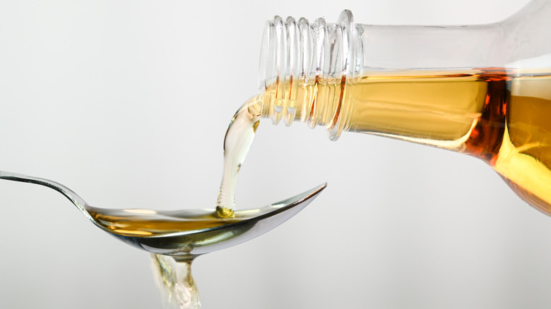 vinegar being poured into a spoon