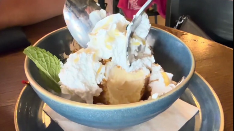 screenshot of two spoons cutting into Chi-Chi's fried ice cream