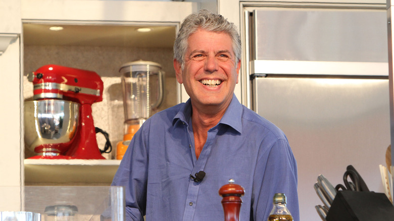 Anthony Bourdain laughing in the kitchen