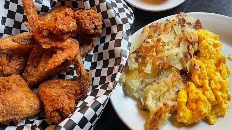 A spread from Daley's Restaurant with chicken wings on the left and omelette on the right.
