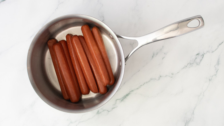 Hot dogs in a large saucepan