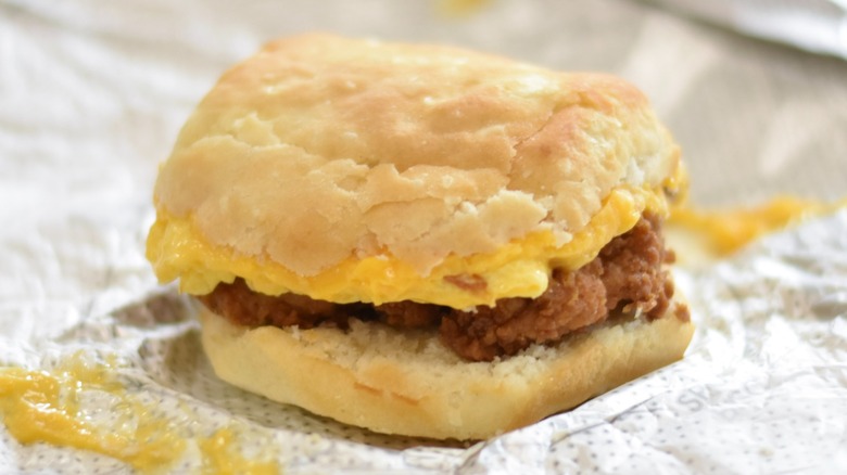 A Chick-fil-A chicken breakfast biscuit on a foil wrapper