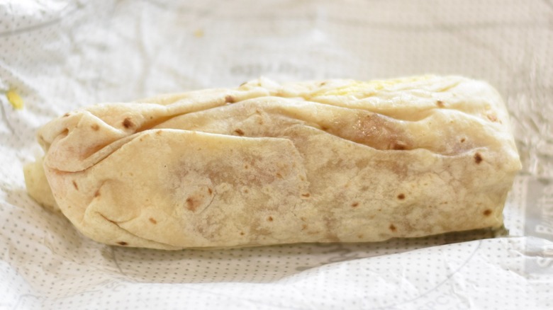 A Chick-fil-A breakfast burrito on a foil wrapper