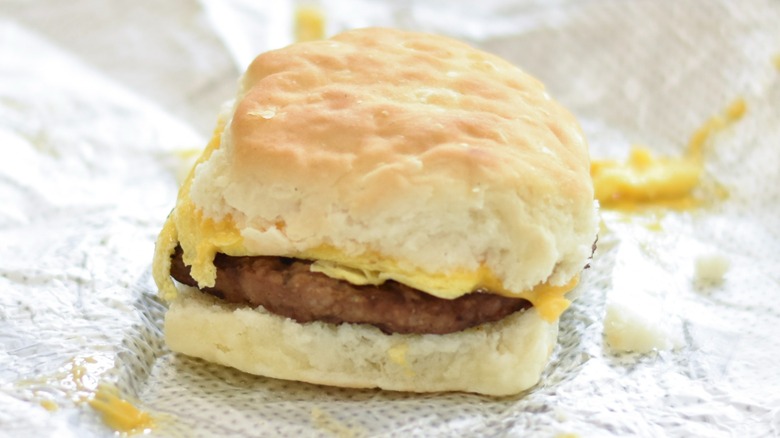A Chick-fil-A sausage breakfast biscuit on a foil wrapper
