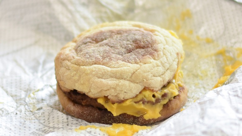 A Chick-fil-A sausage breakfast muffin on a foil wrapper