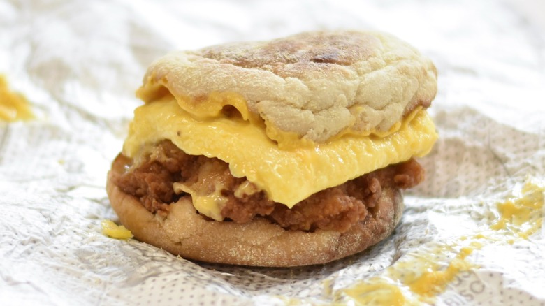A Chick-fil-A chicken breakfast muffin on a foil wrapper