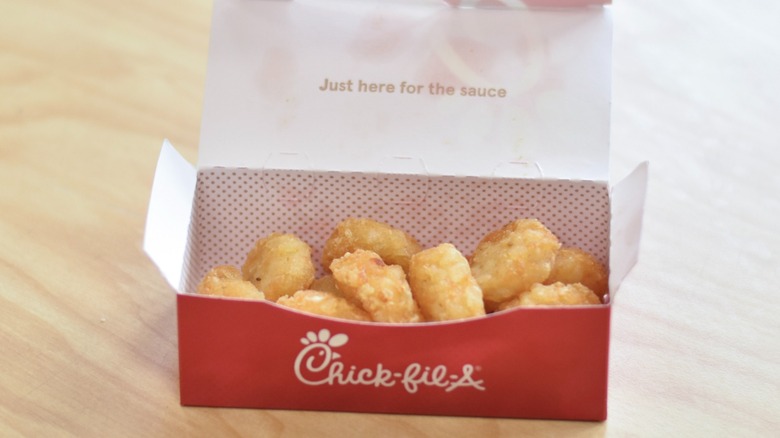 A box of hashbrowns on a wooden table