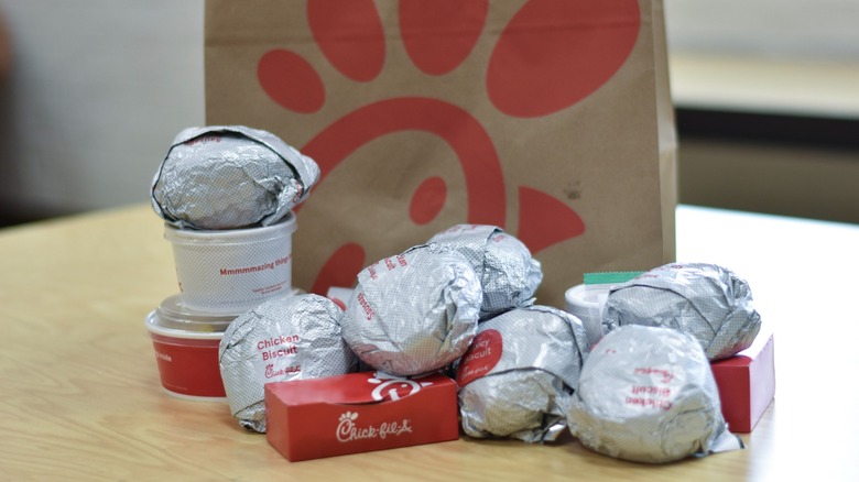 Chick-fil-A breakfast dishes on a table with a Chick-fil-A bag behind it