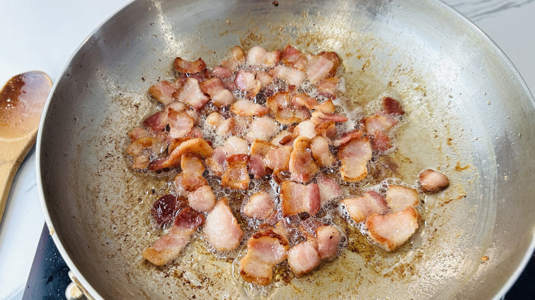 chopped bacon in a frying pan