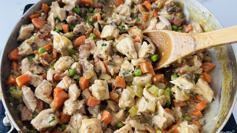 mixed vegetables and chopped chicken in a frying pan
