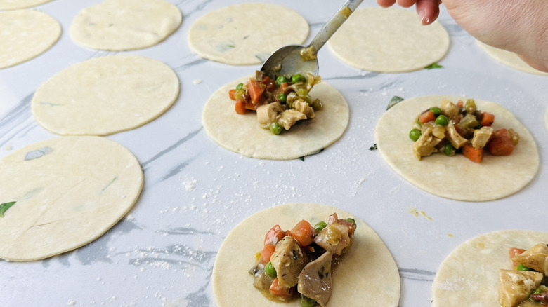 dough circles topped with chicken and vegetables