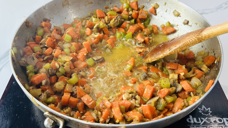 mixed vegetables and liquid in a frying pan