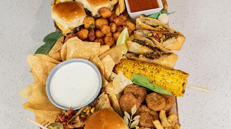 Assortment of various Chili's dishes, including sliders, chips, dips, eggrolls, and more