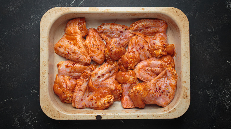 Raw chicken coated in marinade