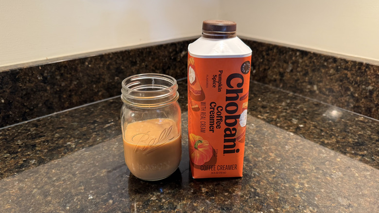 Pumpkin spice coffee creamer on kitchen counter