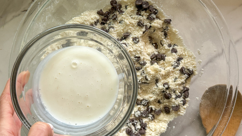 pouring liquid into flour mixture