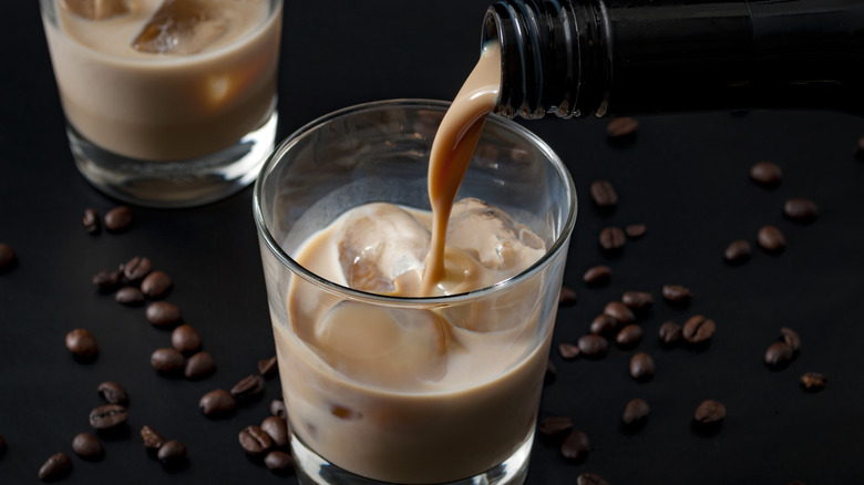 A creamy chocolate liqueur poured into glass