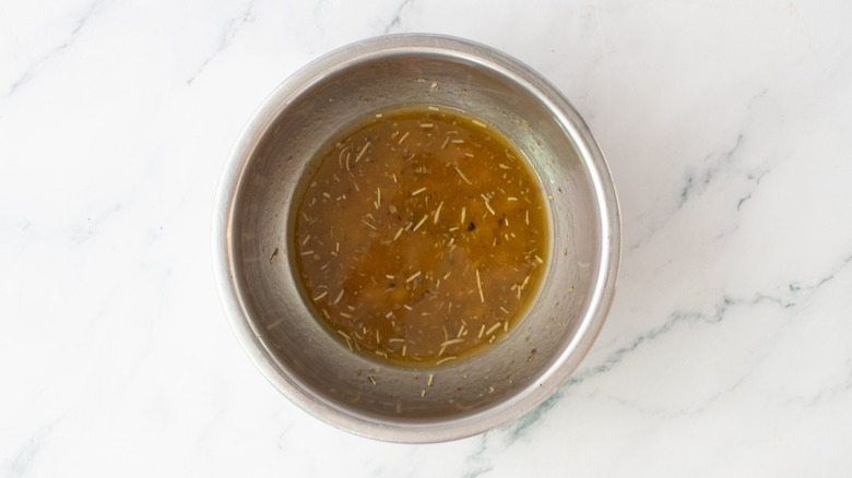 Italian dressing in a medium metal bowl