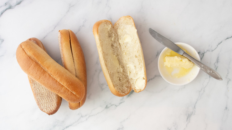 Split rolls smeared with softened butter