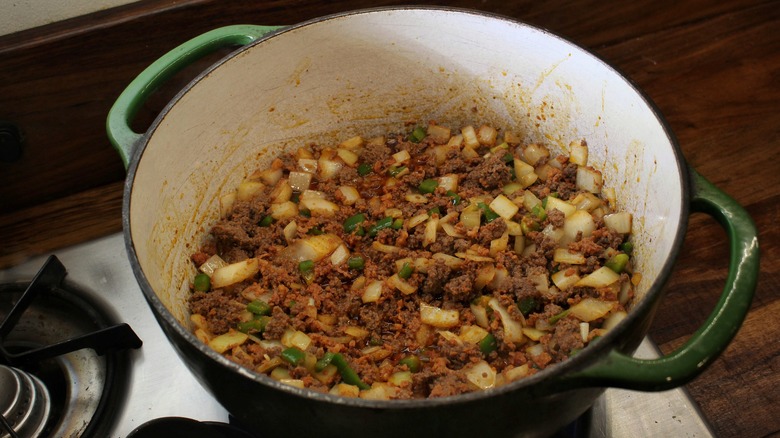 pot of beef, chorizo, onion, and jalapeño