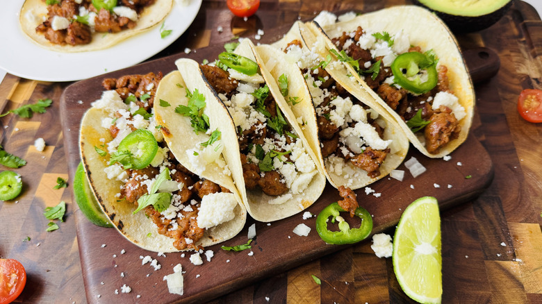 Chorizo street tacos topped with garnishes
