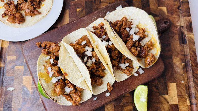 Assembling chorizo tacos on board