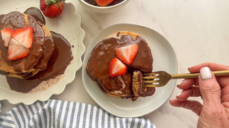 Chocolate covered churro pancakes with strawberries