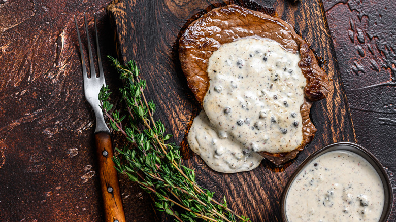 Steak with peppercorn sauce